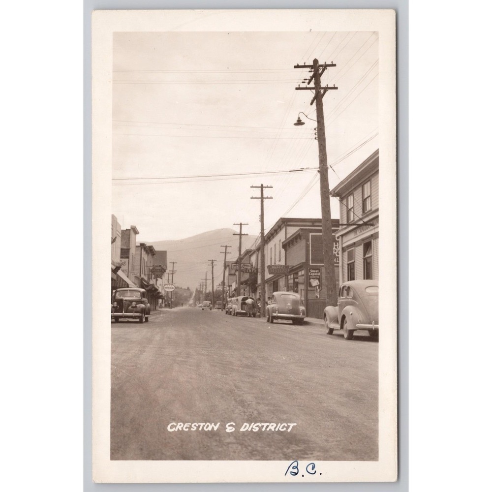 Vintage Creston BC Canada Postcard Real Photo RPPC Street View 1940s Cars Signs